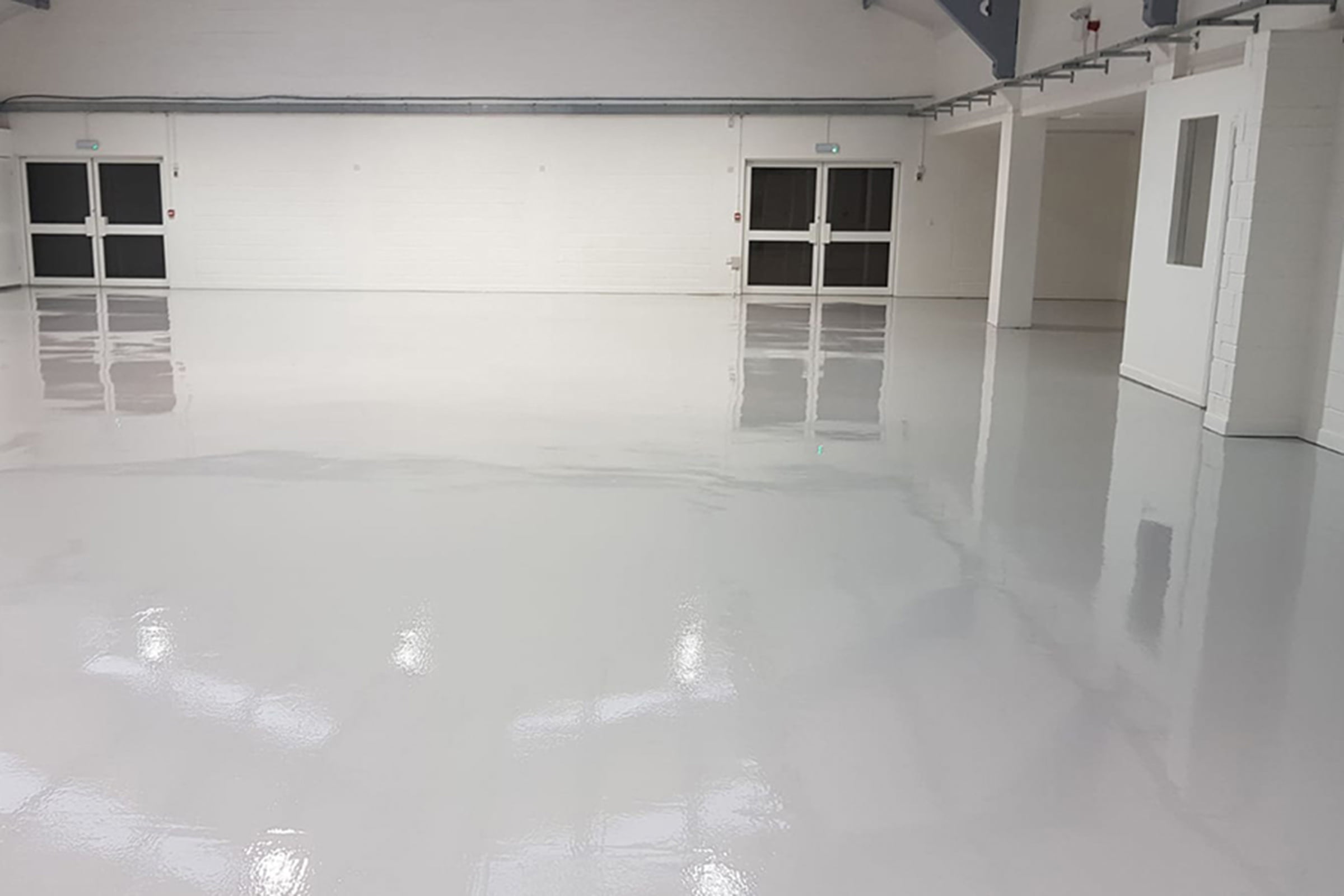 Factory showing newly installed high build epoxy coating. High gloss
