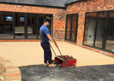 Contractor working on a resin bound project in bedfordshire