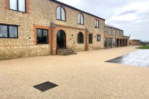 Finished 330m² driveway resin bound driveway in Northamptonshire, showing the customer's residence in the background