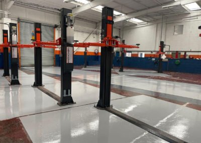 Service bays at an auto workshop in northampton, showing newly installed epoxy resin floor