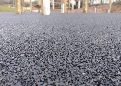 Close up showing finished wet pour rubber surface at an adventure playground in nottingham