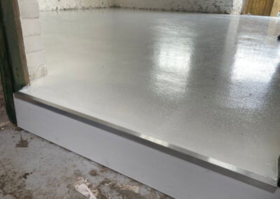 A newly constructed step up into the kennels, showing high build epoxy coating
