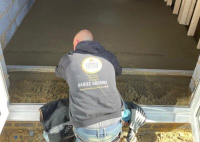 Floor screed contractor finishing off the floor in moulton, northampton