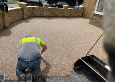 Screed contractor working on a resin bound driveway installation in wellingborough