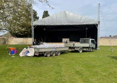 Liberty floor solutions vans loaded with flooring materials in front of the stage at hall park rushden