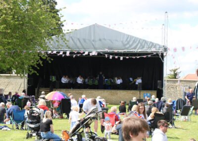 Rushden town band performing on the newly completed resin bound surface at hall park rushden