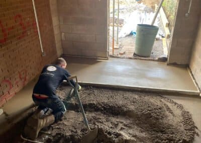 Floor screed contractor at work on a new floor in rugby