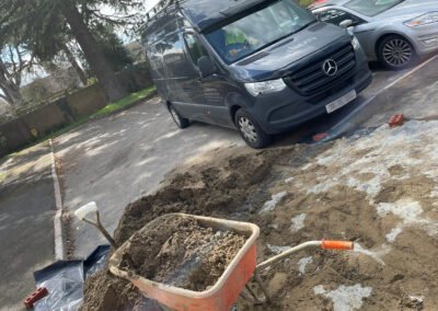 A wheel barrow full of traditional screed, waiting to be used