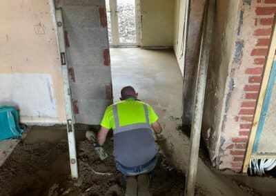 Underfloor heating contractor screeding an extension in rugby
