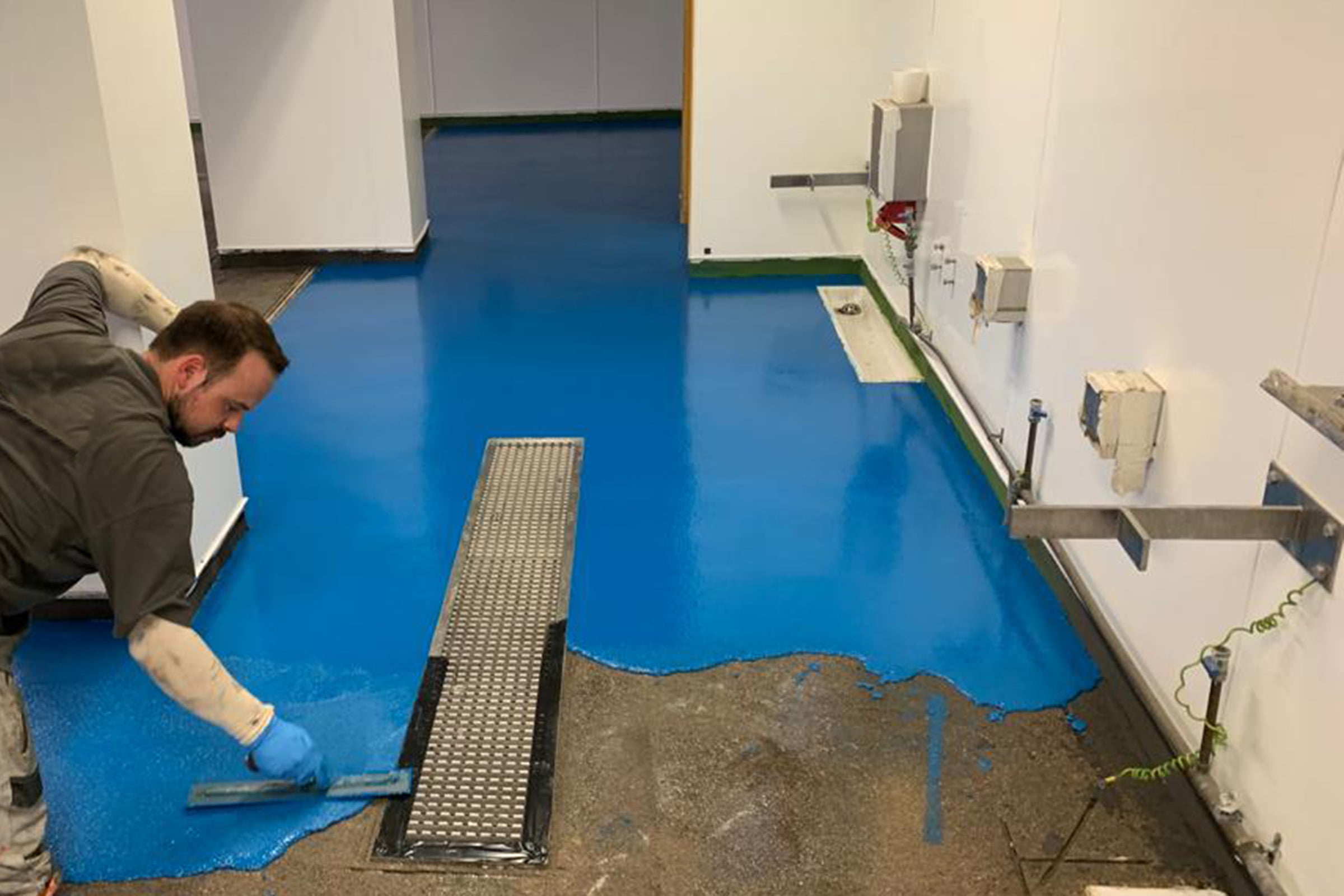 Polyurethane resin flooring being installed in a laboratory