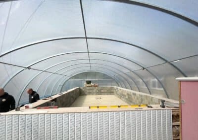 Concrete floor of swimming pool prior to installation of floor screed