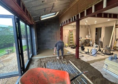 Floor screeding contractor working on underfloor heating screed project