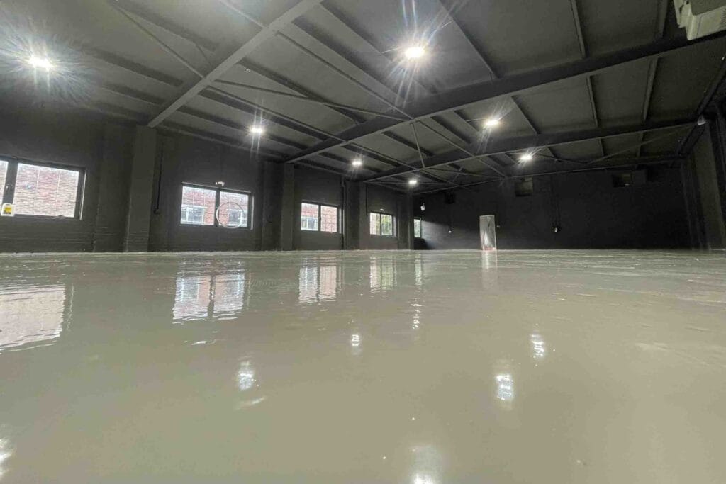 Finished grey epoxy resin coating in a warehouse at bicester