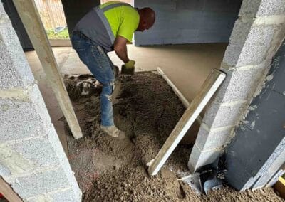 Floor screeding contractor working on an underfloor heating installation