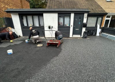 Contractors installing a resin bound driveway in bicester