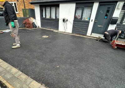 Contractors installing a resin bound driveway in bicester