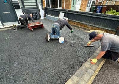 Contractors installing a resin bound driveway in bicester