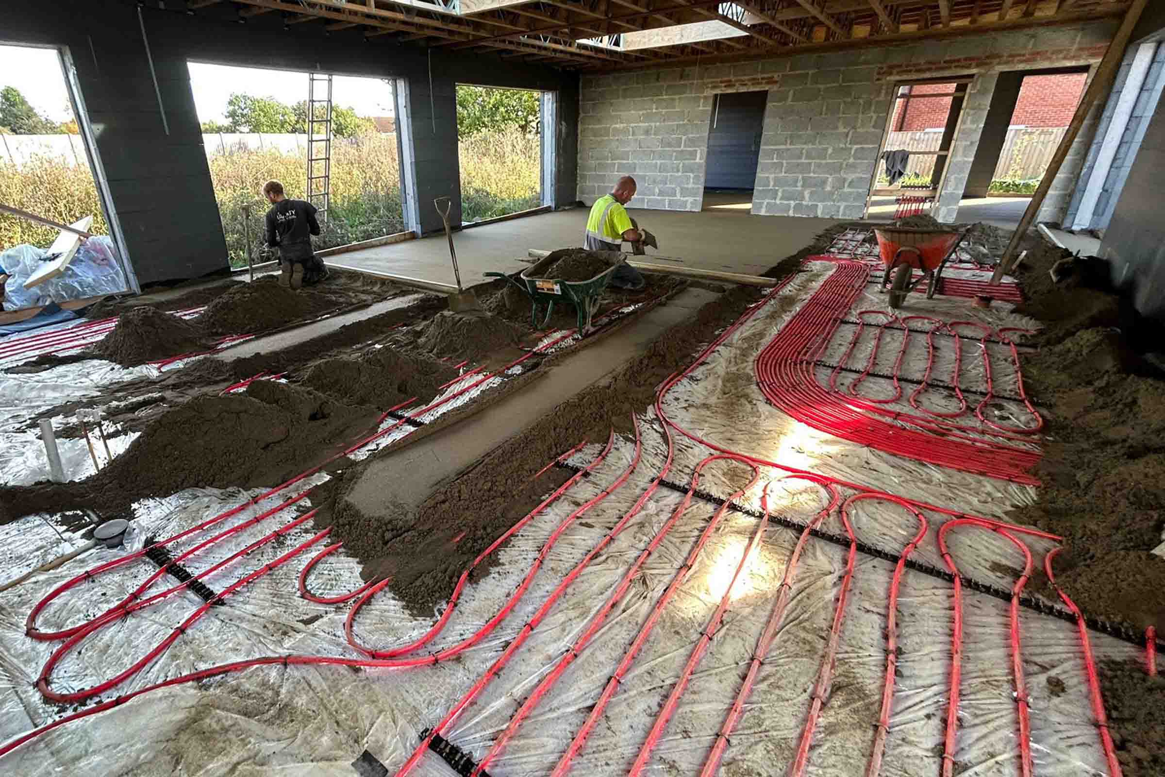 Underfloor heating screed in Bedford Floor screed contractors working on an underfloor heating installation