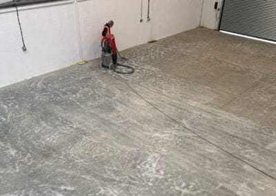 Flooring contractor using industrial hoover