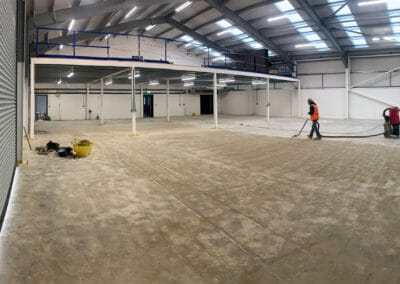 Flooring contractor using an industrial hoover