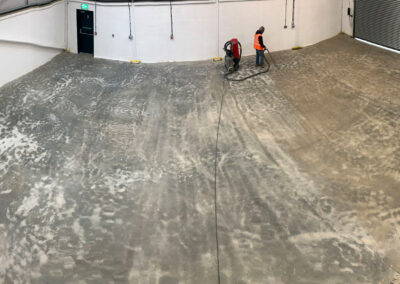 Flooring contractor using industrial hoover