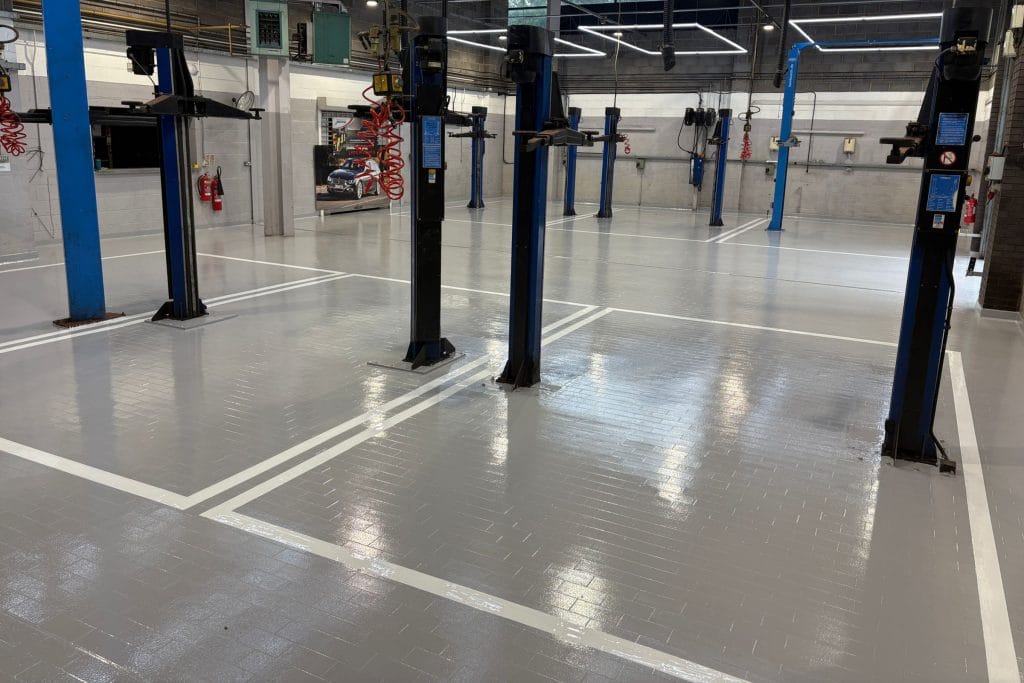 Epoxy resin coating - byd car garage workshop in kettering Finished epoxy resin coating at a garage workshop in kettering