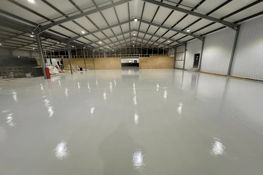 Shiny grey epoxy-coated warehouse floor
