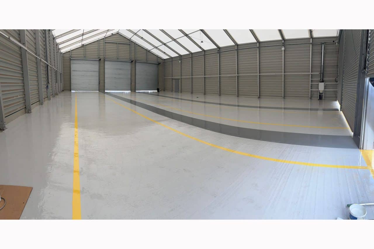 Empty warehouse with new epoxy resin flooring