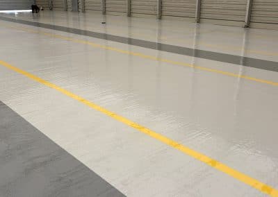 Clean, epoxy resin flooring with yellow line marking