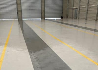 Clean, epoxy resin flooring with yellow line marking