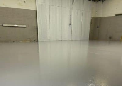 New mid grey epoxy resin flooring at automotive workshop
