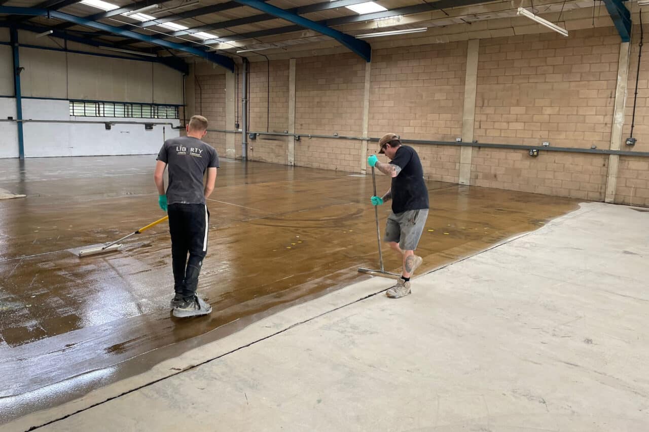 Freshly installed yellow and black resin line marking at an mot test centre in northampton.