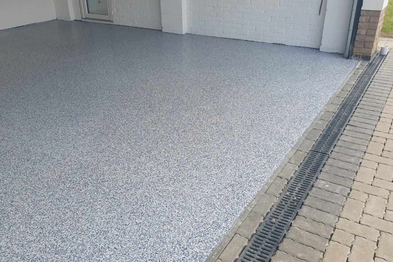 Freshly installed yellow and black resin line marking at an mot test centre in northampton.